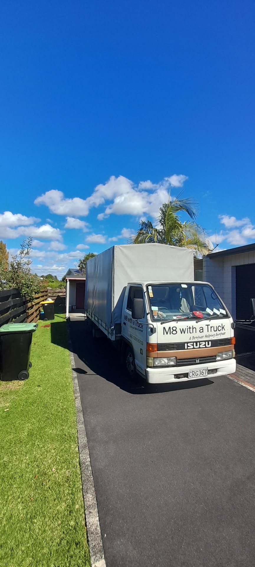 M8 With A Truck Isuzu in a Tauranga driveway